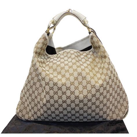 tan gucci handbag with big g on front